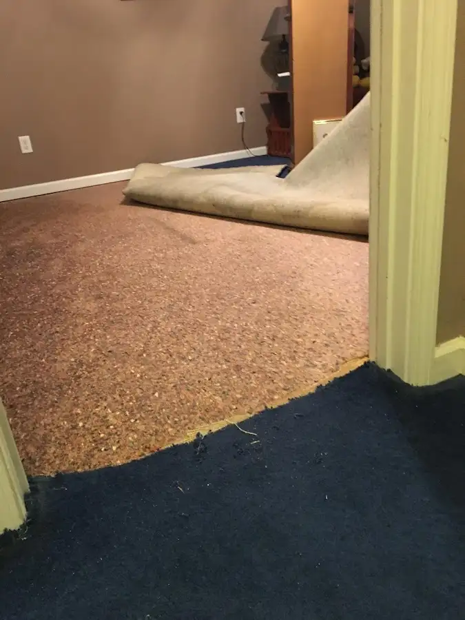Carpet pad removal revealing water damage during Drying & Dehumidification in Midwest City