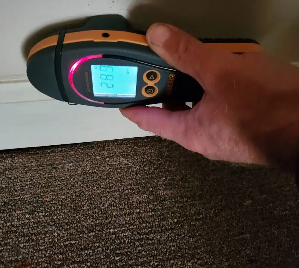 Moisture detection at baseboard during Burst Pipe Cleanup in Midwest City
